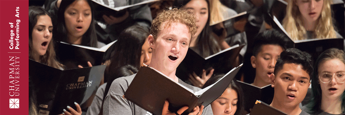 Chapman University College of Performing Arts. Photo of a group of student singers on risers holding their music in black folders.