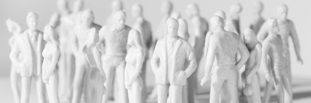 Image of a large group of small plain white human figurines in various poses.