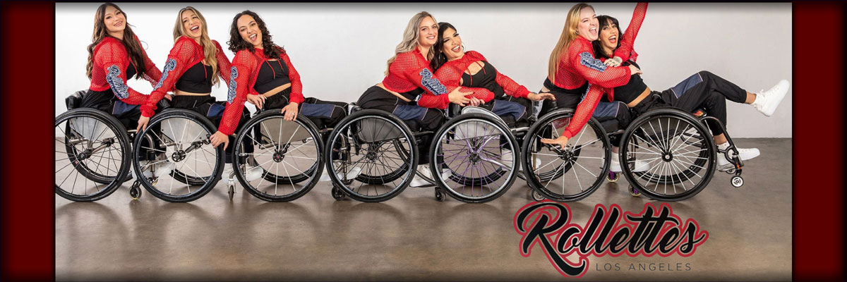 A group of women dancing with wheelchairs. The Rollettes, champions for Inclusion, strike a pose. 